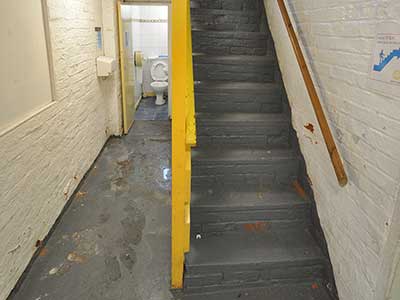 Basement corridor before renovation