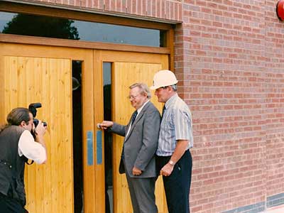 Unlocking the new building, Chairman Prof Hill with the contractor's site manager